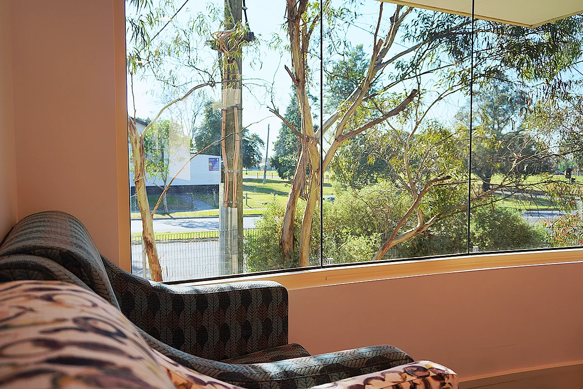 A view of the leafy Ashburton street and trees from a room at Samarinda Lodge, BASSCARE's residential aged care home.