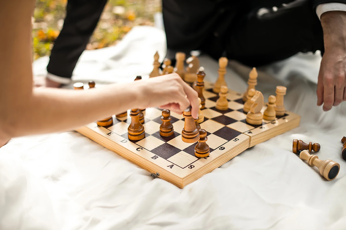 Two people playing chess, representing the engaging social activities supported by BASSCARE's Home and Community Care Program for Younger People (HACC PYP) in Boroondara.