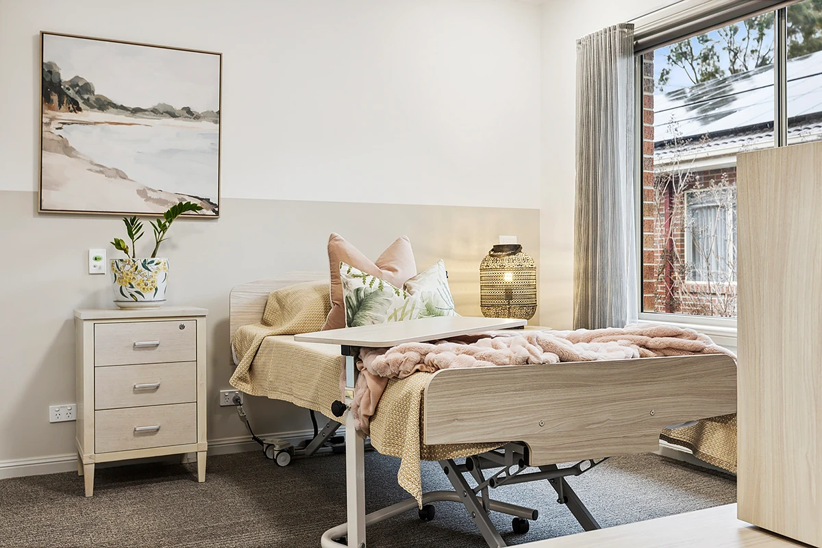 A comfortable, fully adjustable bed in a private room at Faversham House, ensuring resident comfort at this residential aged care home in Canterbury